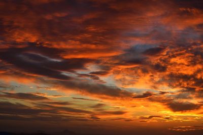 Low angle view of dramatic sky during sunset