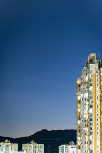 Buildings in city at night