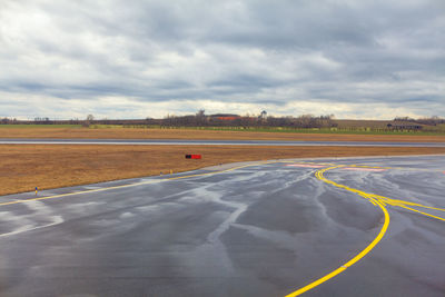 Airport runway in the rainy day . plane getting off the ground