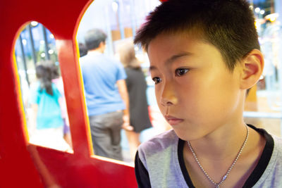 Close-up of boy looking away