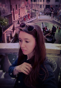 Portrait of young woman sitting outdoors