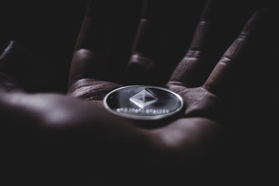 Close-up of hand holding eyeglasses