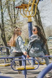 Gen z girls enjoying outdoors, expressing positive emotions. outdoor photo of two girl friends 