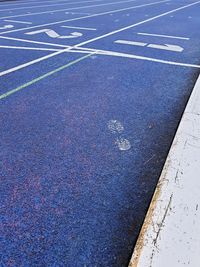 High angle view of arrow symbol on road