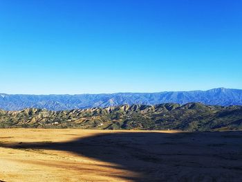 Scenic view of landscape against clear blue sky