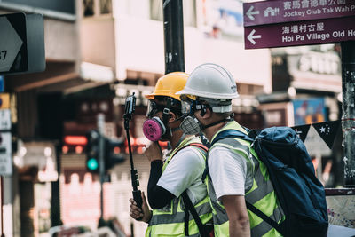 People standing on street in city