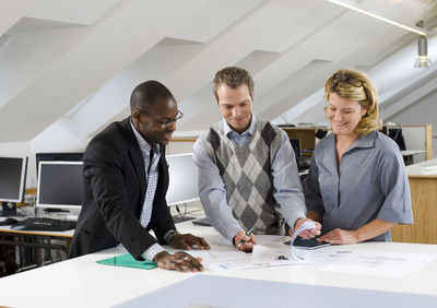 Coworkers having discussion in office