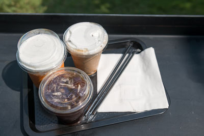 Top view of ice americano black coffee, espresso, and thai tea to drink in outdoor cafe