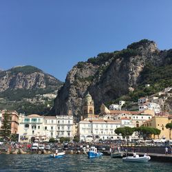 Boats moored at harbor