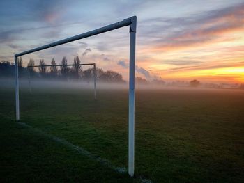 View of soccer field against cloudy sky