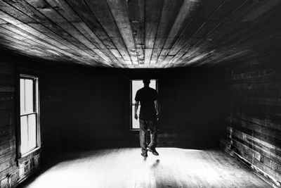 Woman standing in tunnel