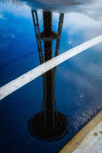 High angle view of reflection in puddle on street