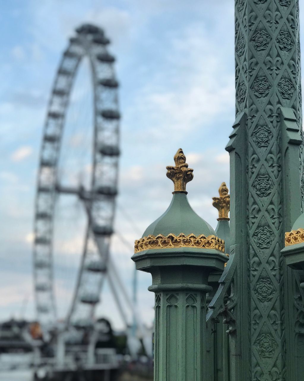 LOW ANGLE VIEW OF CAROUSEL AGAINST SKY