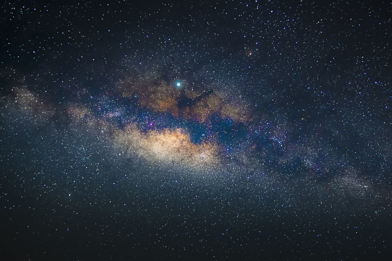 LOW ANGLE VIEW OF STAR FIELD AGAINST SKY