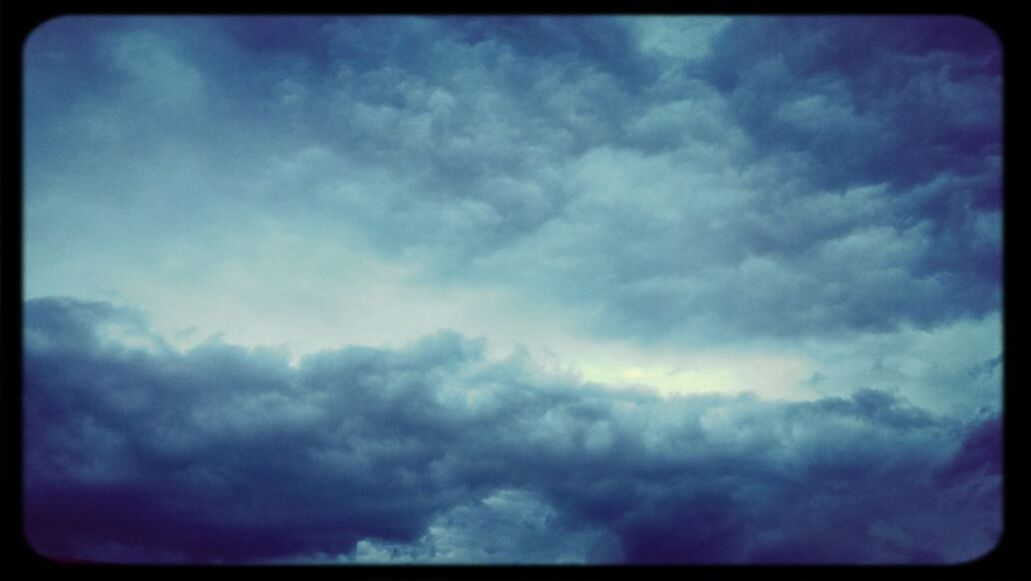 transfer print, sky, cloud - sky, cloudy, low angle view, auto post production filter, beauty in nature, scenics, tranquility, cloudscape, nature, cloud, tranquil scene, weather, sky only, overcast, idyllic, blue, backgrounds, storm cloud