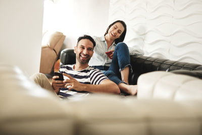 Friends sitting on sofa