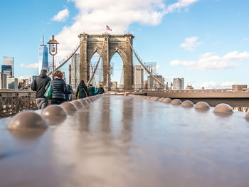 Bridge over river with city in background