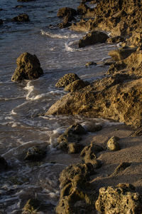 High angle view of rocks in sea