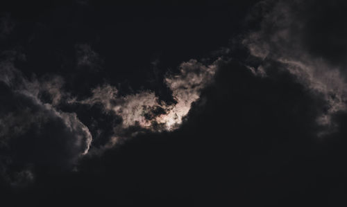 Low angle view of dramatic sky at night