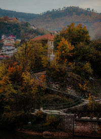 High angle view of trees and buildings against sky