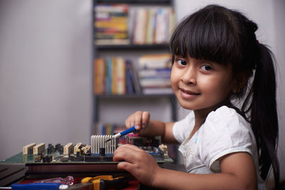 Portrait of smiling girl playing at music concert