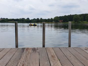 Girl sitting in boat on lake