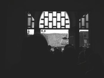 Silhouette people in corridor of building