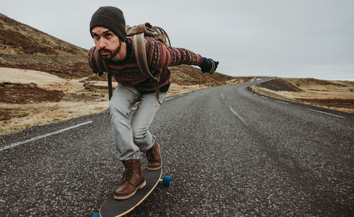 Man skateboarding on highway