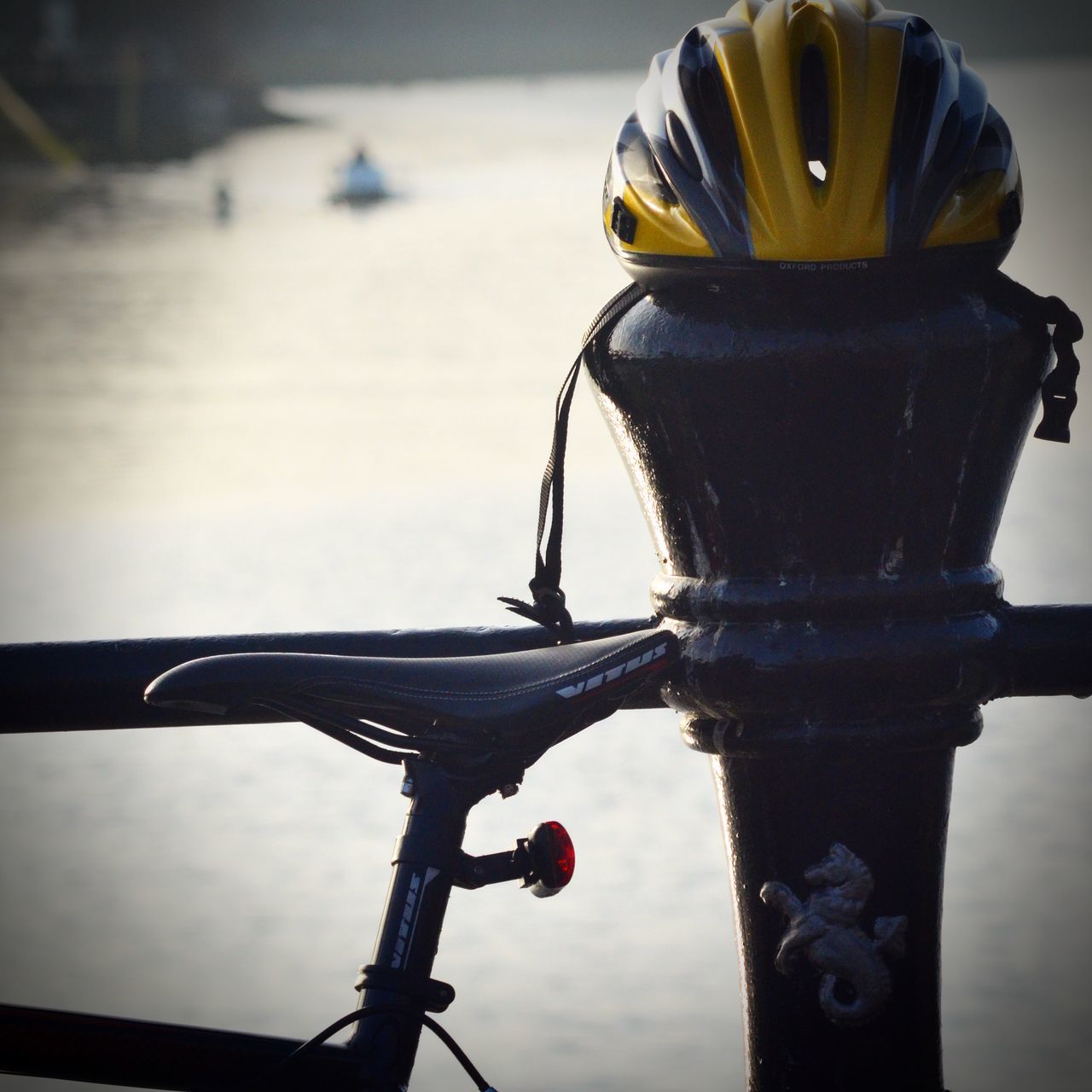 focus on foreground, close-up, sky, sunset, water, metal, reflection, outdoors, no people, nature, day, dusk, railing, yellow, hanging, sunlight, pole, protection, tranquility, sea