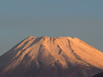 View of volcanic mountain against sky