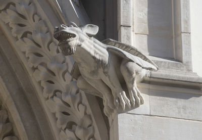 Low angle view of statue against building