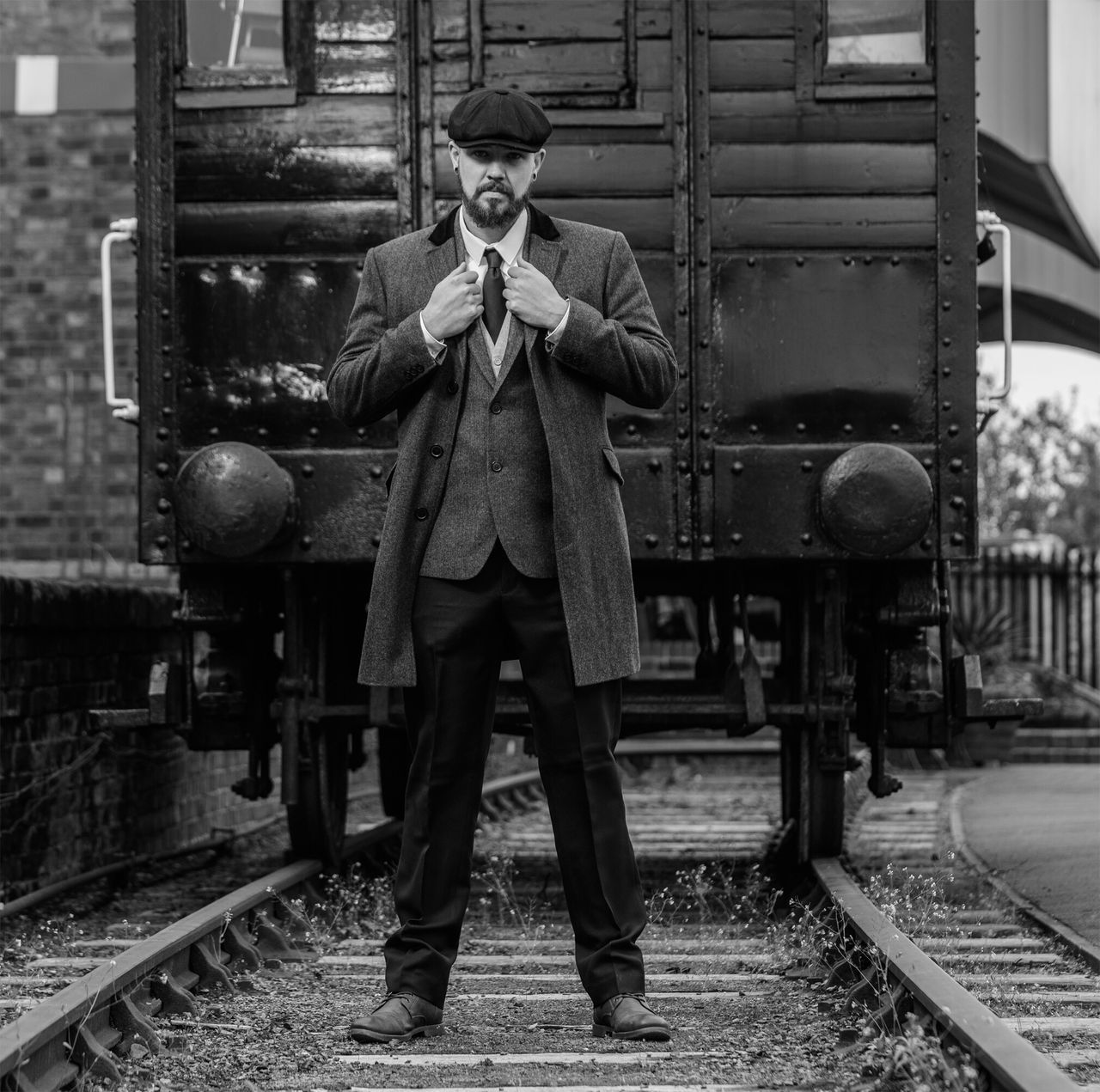 rail transportation, railroad track, transportation, standing, real people, one person, front view, train - vehicle, full length, day, young adult, men, lifestyles, outdoors, adult, people