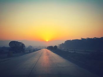 Road against sky during sunset