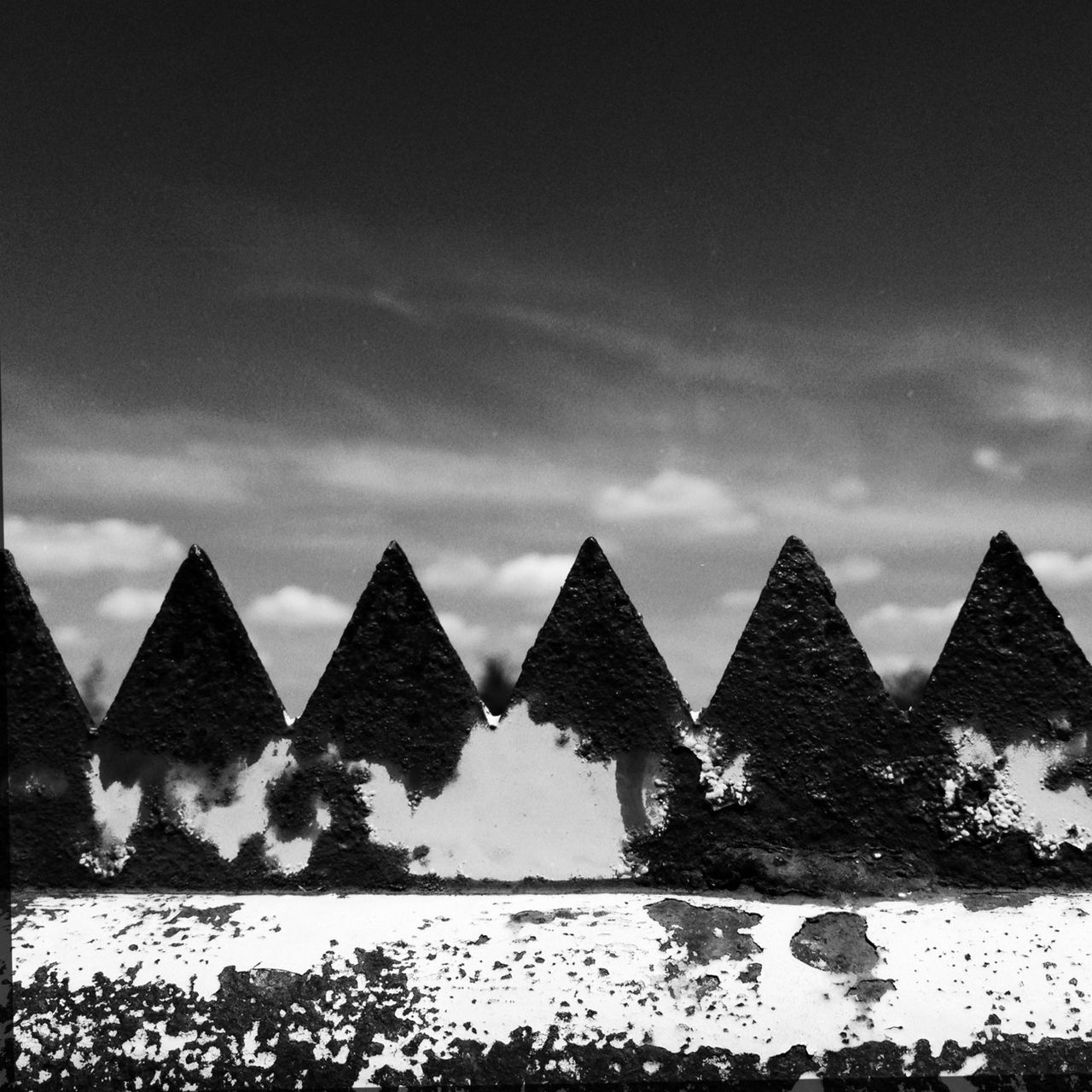 architecture, built structure, building exterior, sky, roof, cloud - sky, house, cloud, day, outdoors, low angle view, religion, stone wall, spirituality, cloudy, sunlight, wall - building feature, no people, place of worship, stone material