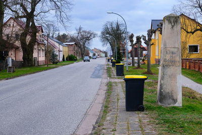 Street amidst houses and buildings in city