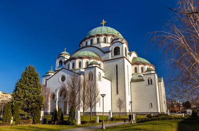 Low angle view of traditional building against clear blue sky