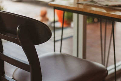 Close-up of empty chairs and table in restaurant