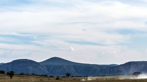 View of mountain range against cloudy sky