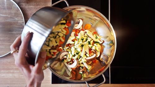 High angle view of person preparing food on table