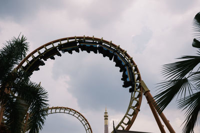 Low angle view of ferris wheel against sky
