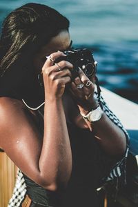 Midsection of woman photographing