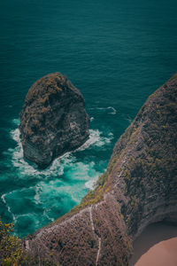 High angle view of rock formation in sea