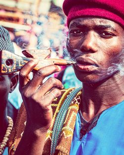 Close-up of man smoking cigarette