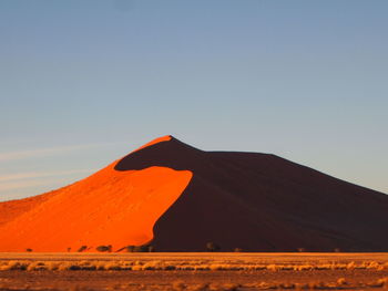 Scenic view of desert against clear sky