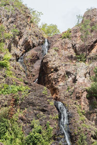 Low angle view of rocks on mountain