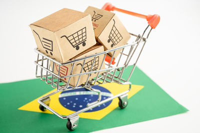 High angle view of shopping cart against white background