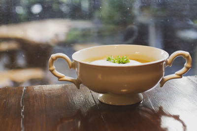 Mushroom soup in ceramic bowl breakfast meal healthy on the wooden table.