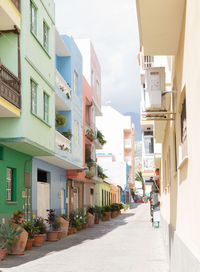 Alley amidst buildings in city