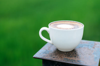 Close-up of coffee cup on table