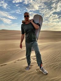 Full length of young man in desert